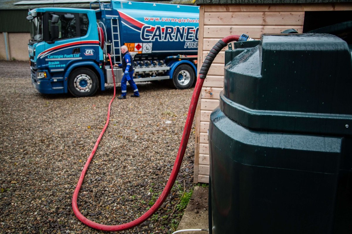 A fuel hose tank attached to an outdoor domestic oil tank connected to a Carnegie Fuels fuelling tank in Scotland.